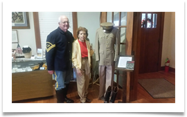 Col. Sam Young, Editor, U.S. Cavalry Journal with Raqui beside Ed's uniform and boots at the U.S. Cavalry Museum